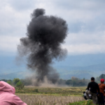explosion and smoke over open field