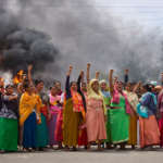 women in colorful sarees in protest