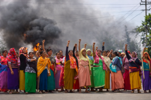 women in colorful sarees in protest